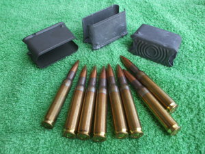 Eight .30-06 Springfield cartridges with M1 Garand en bloc clips.
