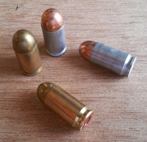 9x18mm pistol ammunition cartridges.  Aluminum cases from Bear and brass cases with lacquered primers from Sellier & Bellot.