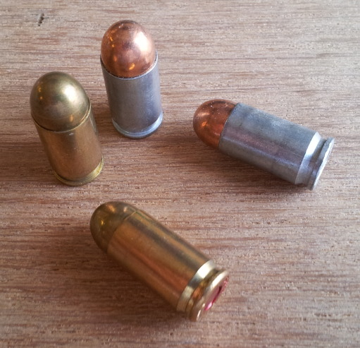 9x18mm pistol ammunition cartridges. Aluminum cases from Bear and brass cases with lacquered primers from Sellier & Bellot.