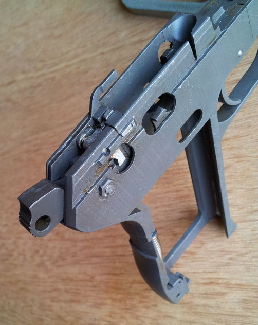 ČZ-52 pistol frame showing hammer, trigger, and safety.