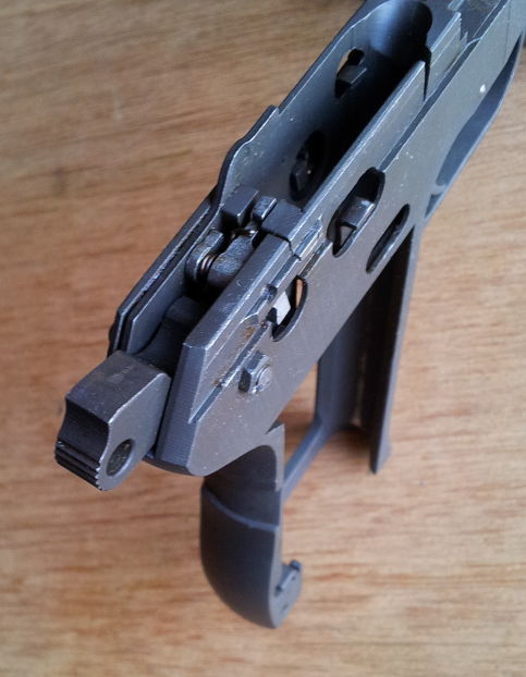 ČZ-52 pistol frame showing hammer, trigger, and safety.