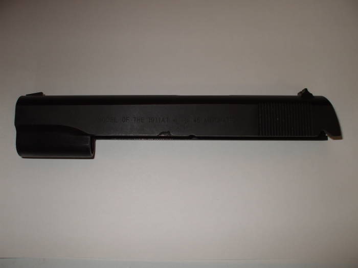 M1911A1 pistol slide. Original finish from Norinco, nearly black uneven blued steel surface.