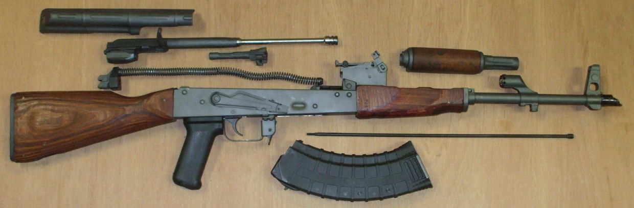 Disassemble the AK-47 rifle into its major components.