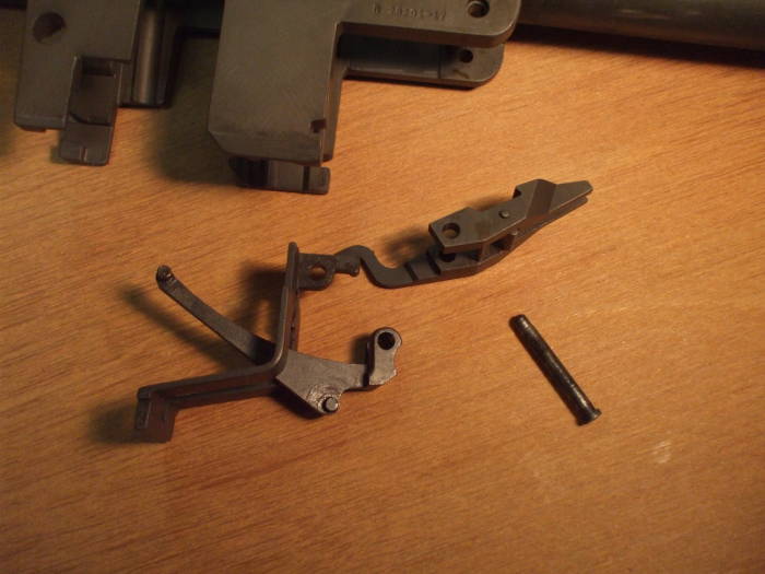 Remove the operating rod catch, follower arm, and bullet guide.