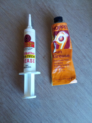 Two tubes of gun grease.