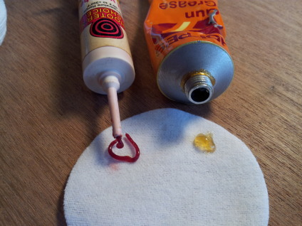 Two tubes of gun grease.