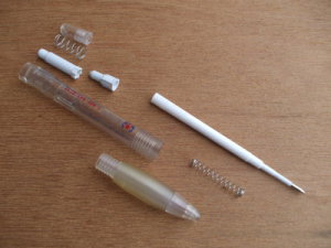 Disassembled ballpoint pen.