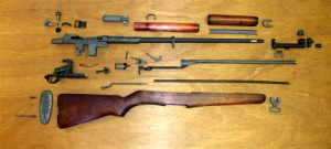 M1 Garand rifle collection of parts ready for assembly.