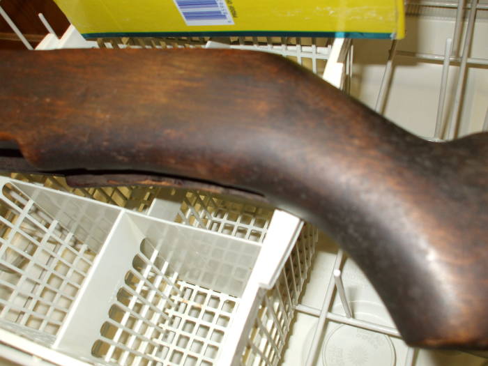 Dishwasher cleaning of an M1 Garand rifle stock. Darker wood before cleaning.