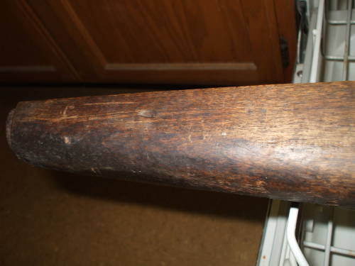 Dishwasher cleaning of an M1 Garand rifle stock. Dark and dirty wood before cleaning.
