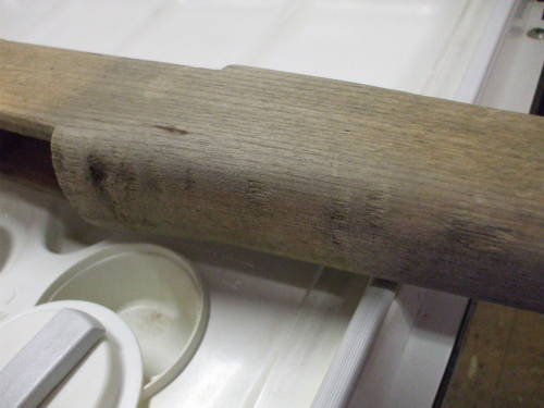Dishwasher cleaning of an M1 Garand rifle stock. Light wood after cleaning.