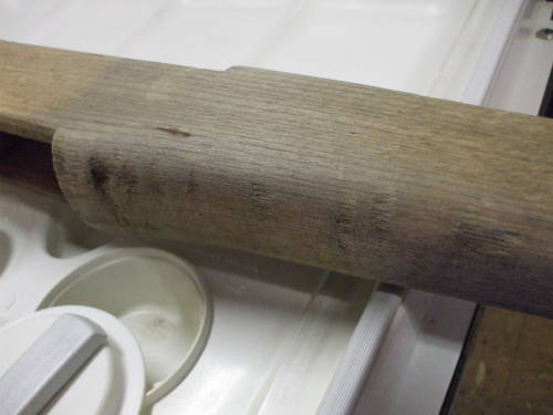 Dishwasher cleaning of an M1 Garand rifle stock.  Light wood after cleaning.